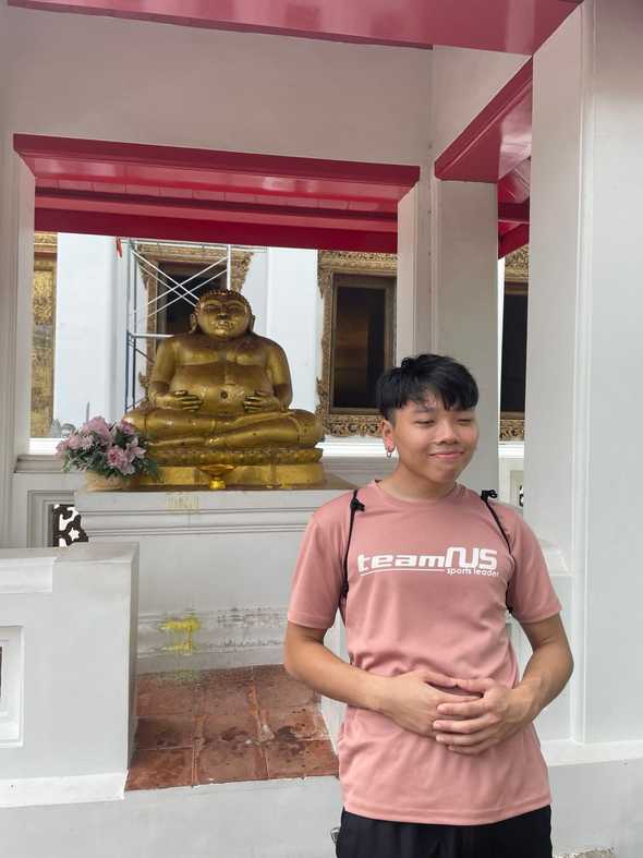 Wen Wu posing as Buddha